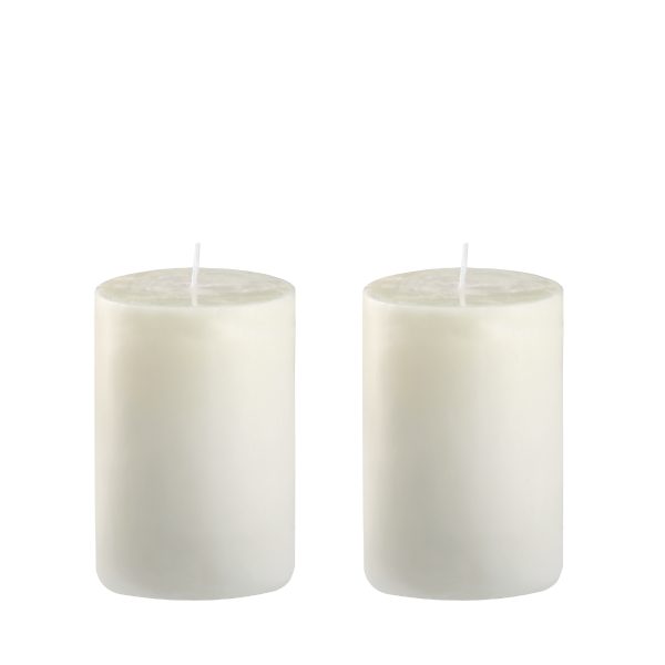 Two white cylindrical candles on a transparent background.