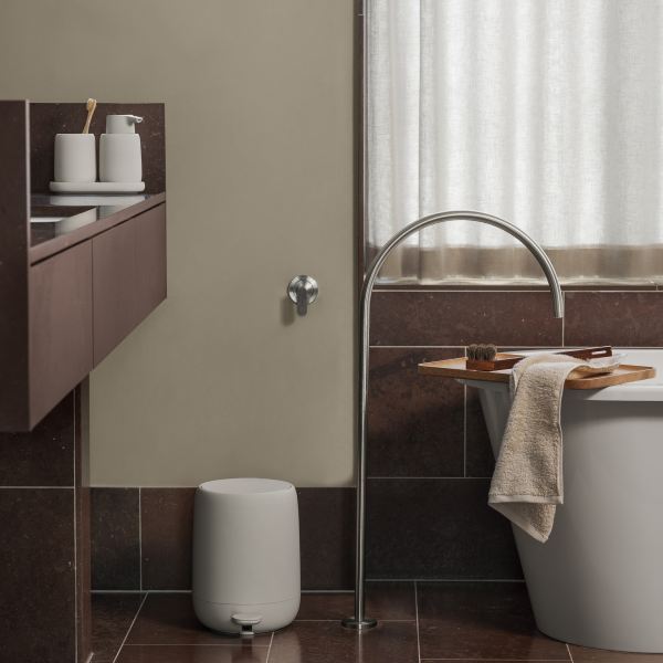 Modern bathroom design featuring a stylish tub, minimalist decor, and sleek fixtures.