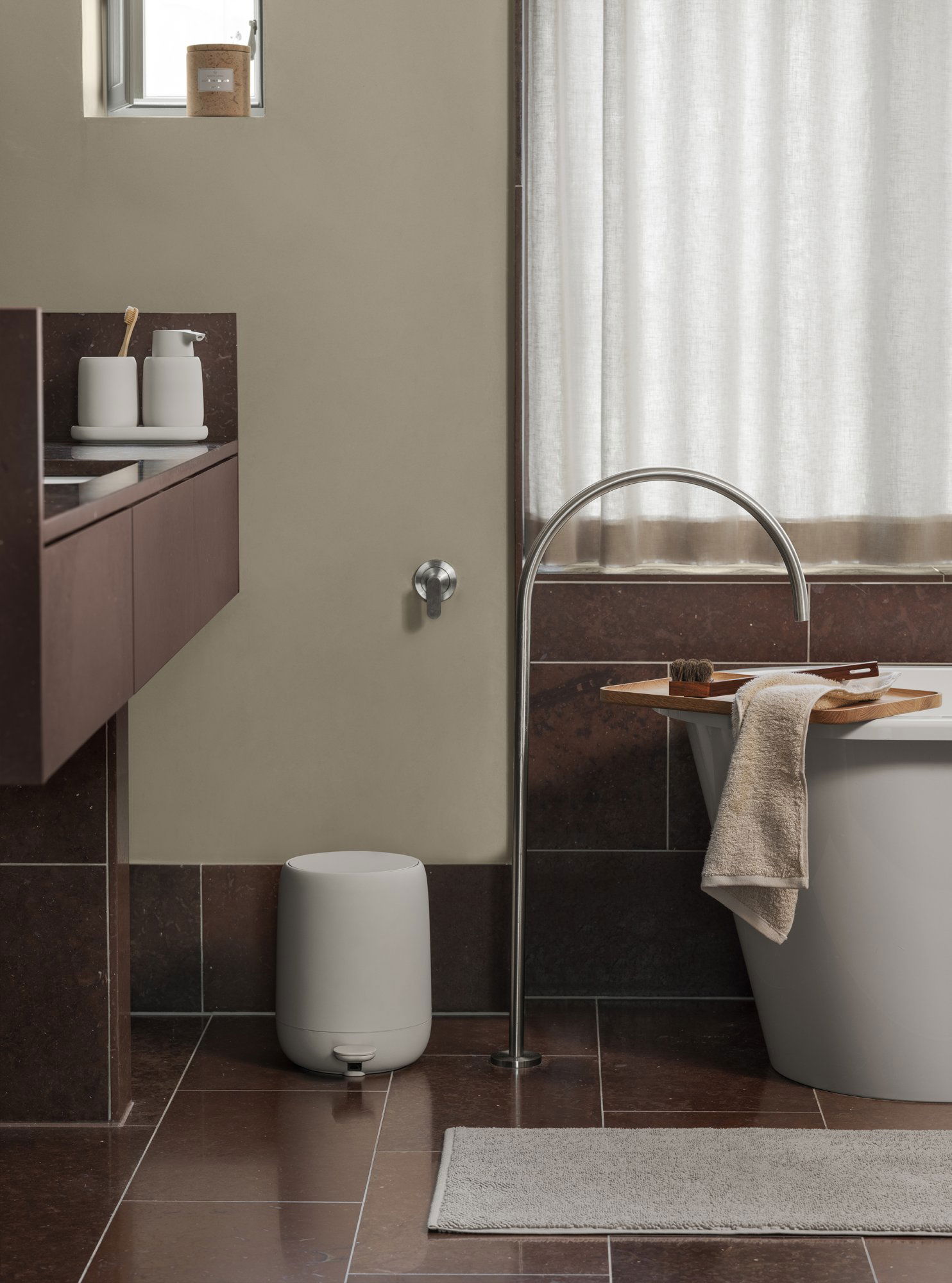 Modern bathroom design featuring a stylish tub, minimalist decor, and sleek fixtures.