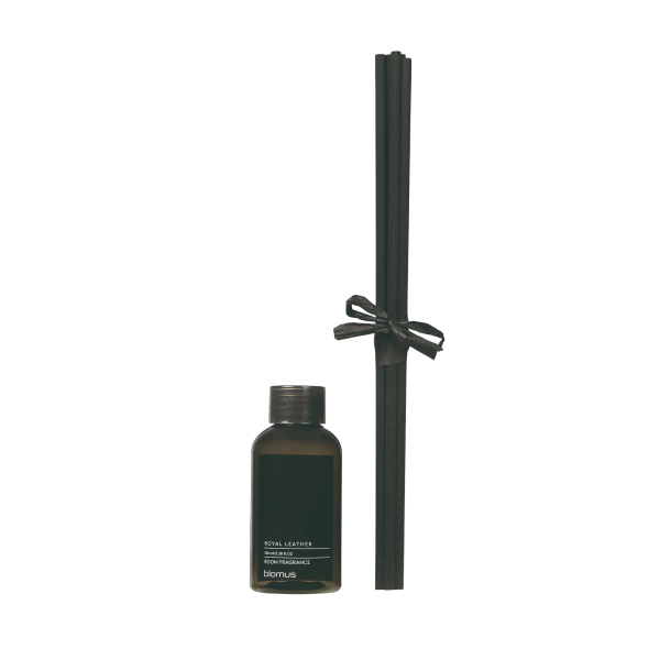 Elegant room fragrance diffuser with a Royal Leather scent and decorative reeds.