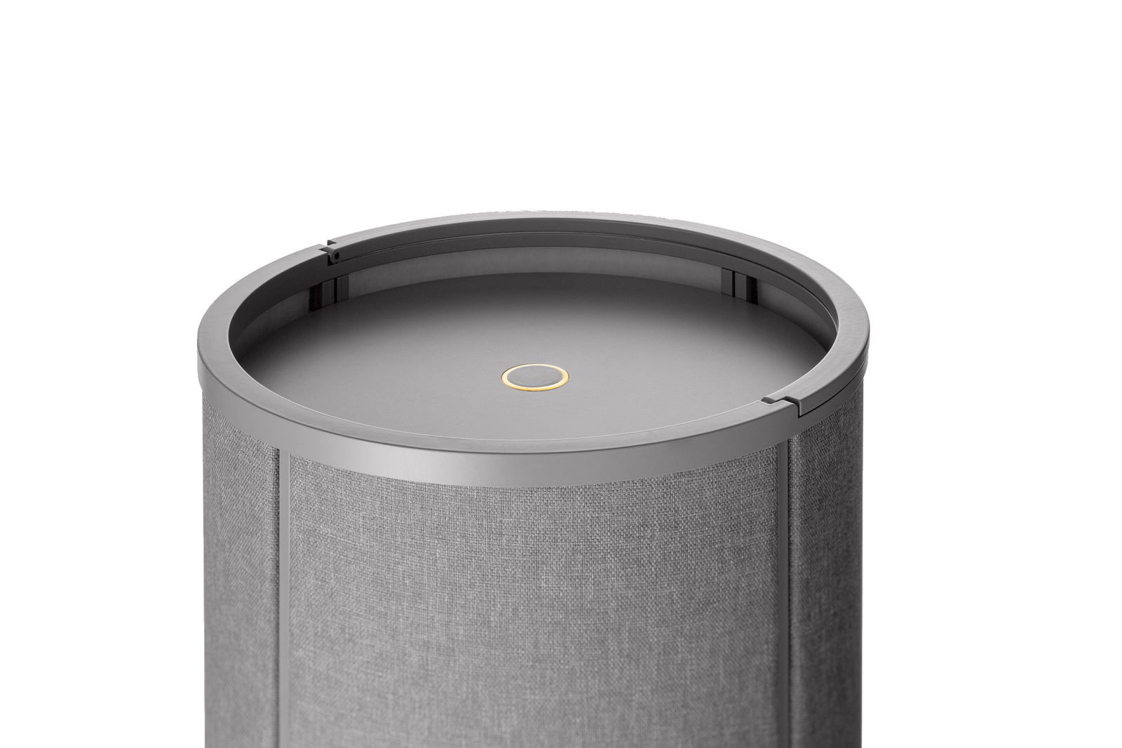Stylischer grauer zylindrischer Lautsprecher mit minimalistischem Design und kreisförmiger Steueroberfläche.