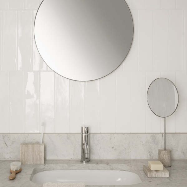 Modern bathroom sink with stylish mirrors and minimalist decor elements.