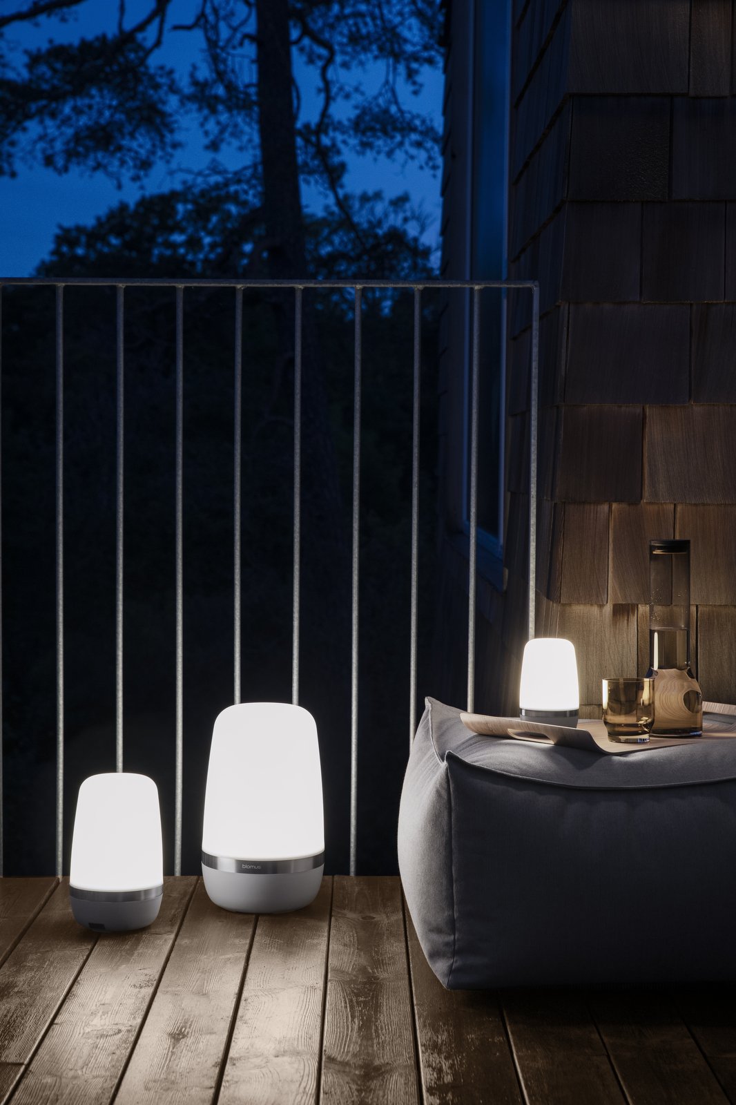 Modern outdoor lighting on a balcony creating a cozy evening ambiance.