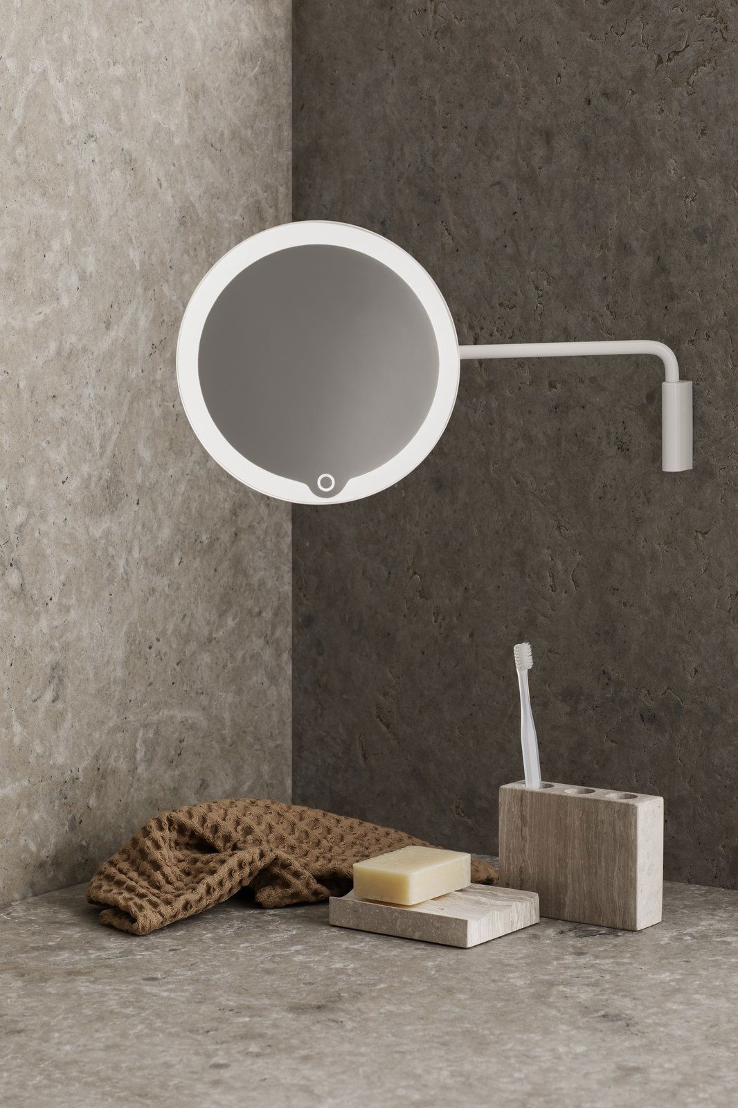Modern wall-mounted mirror with LED lighting in a stylish bathroom setting.