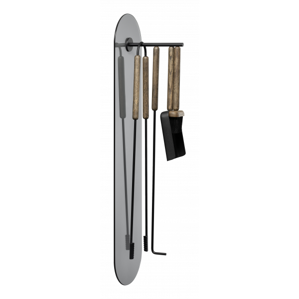 Stylish kitchen utensils hanging on a wall-mounted rack for modern cooking.