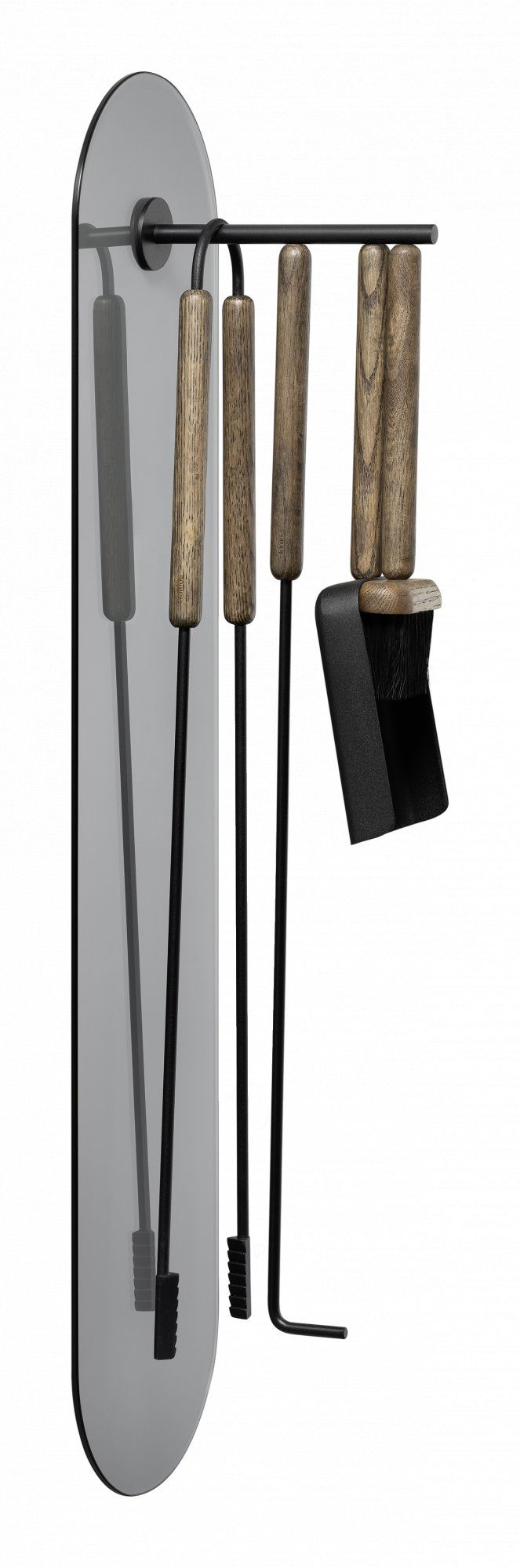 Stylish kitchen utensils hanging on a wall-mounted rack for modern cooking.