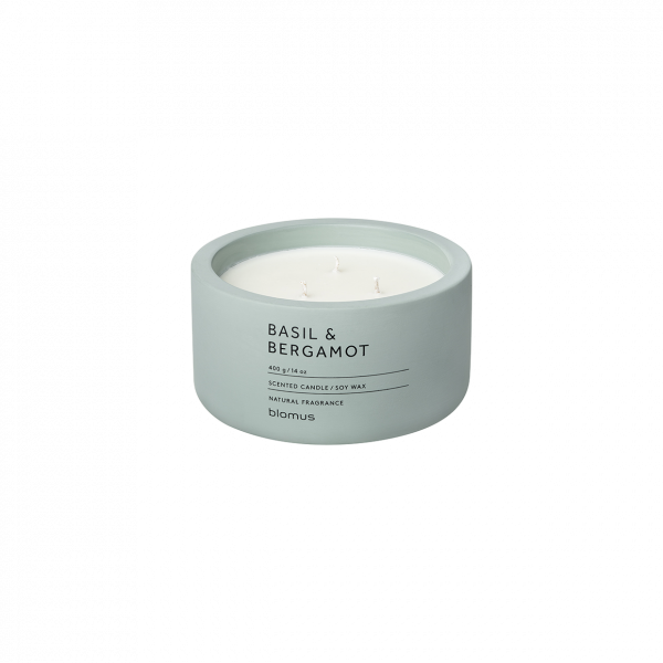 Basil and bergamot scented candle in a simple white container.