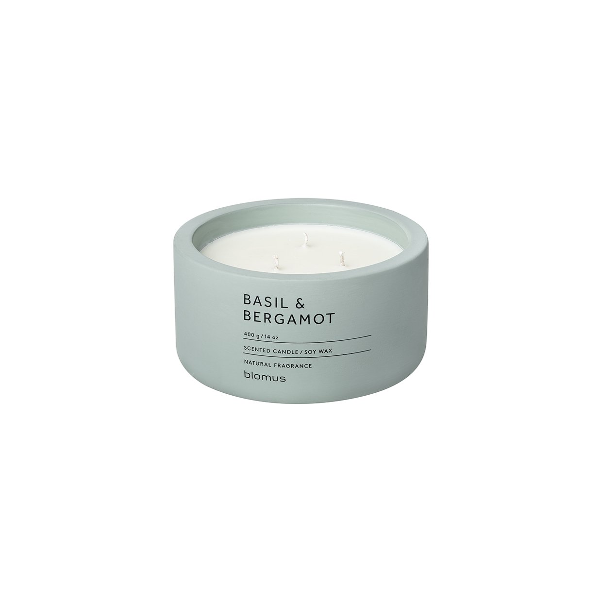 Basil and bergamot scented candle in a simple white container.