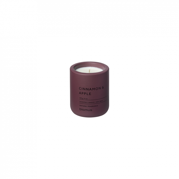 Cinnamon and apple scented candle in a burgundy container for cozy ambiance.
