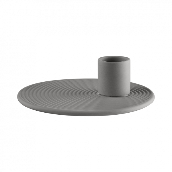 Modern gray candle holder with a circular base and textured design.