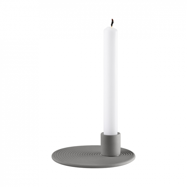 Stylish white candle in a modern gray holder, perfect for home decor.