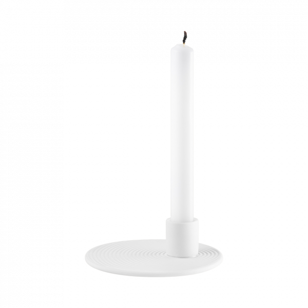 Minimalist white candle holder with a tall white candle, perfect for modern decor.