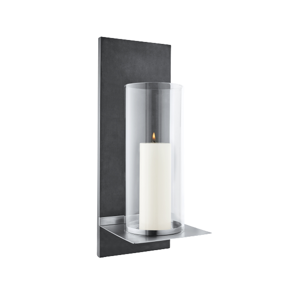 Modern wall-mounted lamp with a sleek design and warm white light illuminating a dark wall.