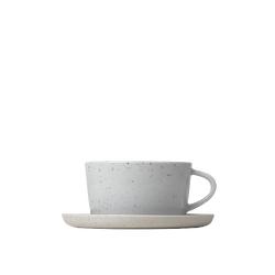 Minimalist white coffee cup and saucer on a light background.