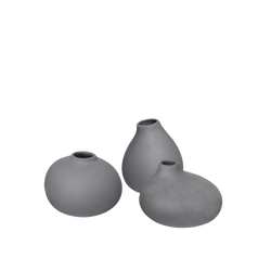 Three gray ceramic decorative vases arranged together on a light background.