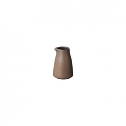 Handcrafted ceramic jug with a smooth, earthy finish on a black background.