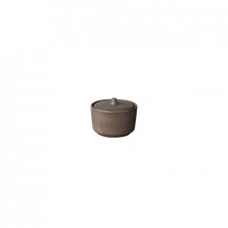 Ceramic container with a lid, showcasing minimalist design and earthy tones.