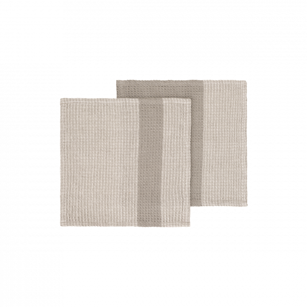 Zwei beige, strukturierte Stoffmuster elegant auf einem schwarzen Hintergrund präsentiert.