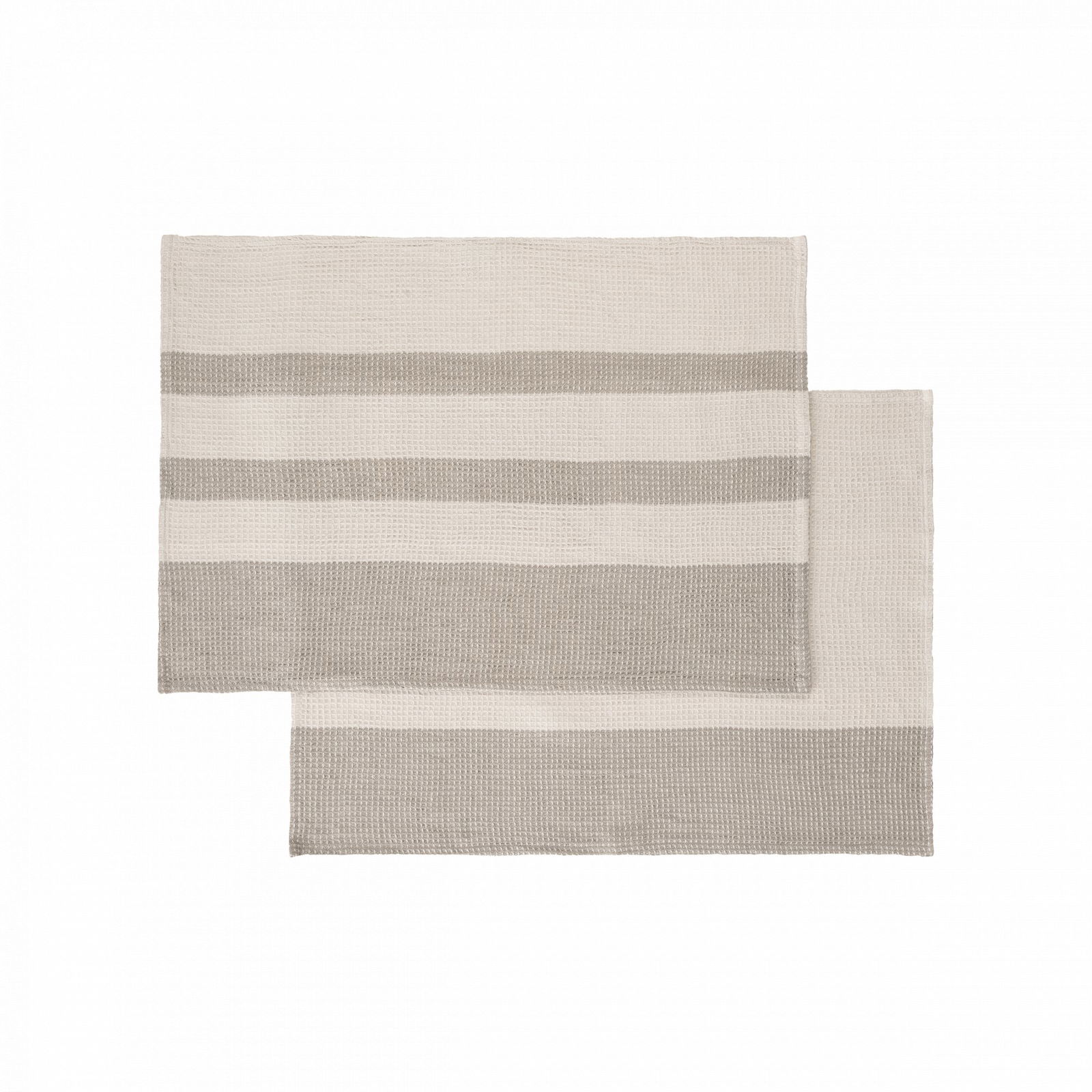 Striped woven placemats in neutral tones for stylish dining table decor.