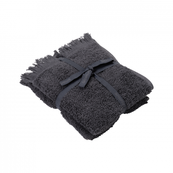 Soft, luxurious dark gray towel neatly folded and tied with a ribbon.