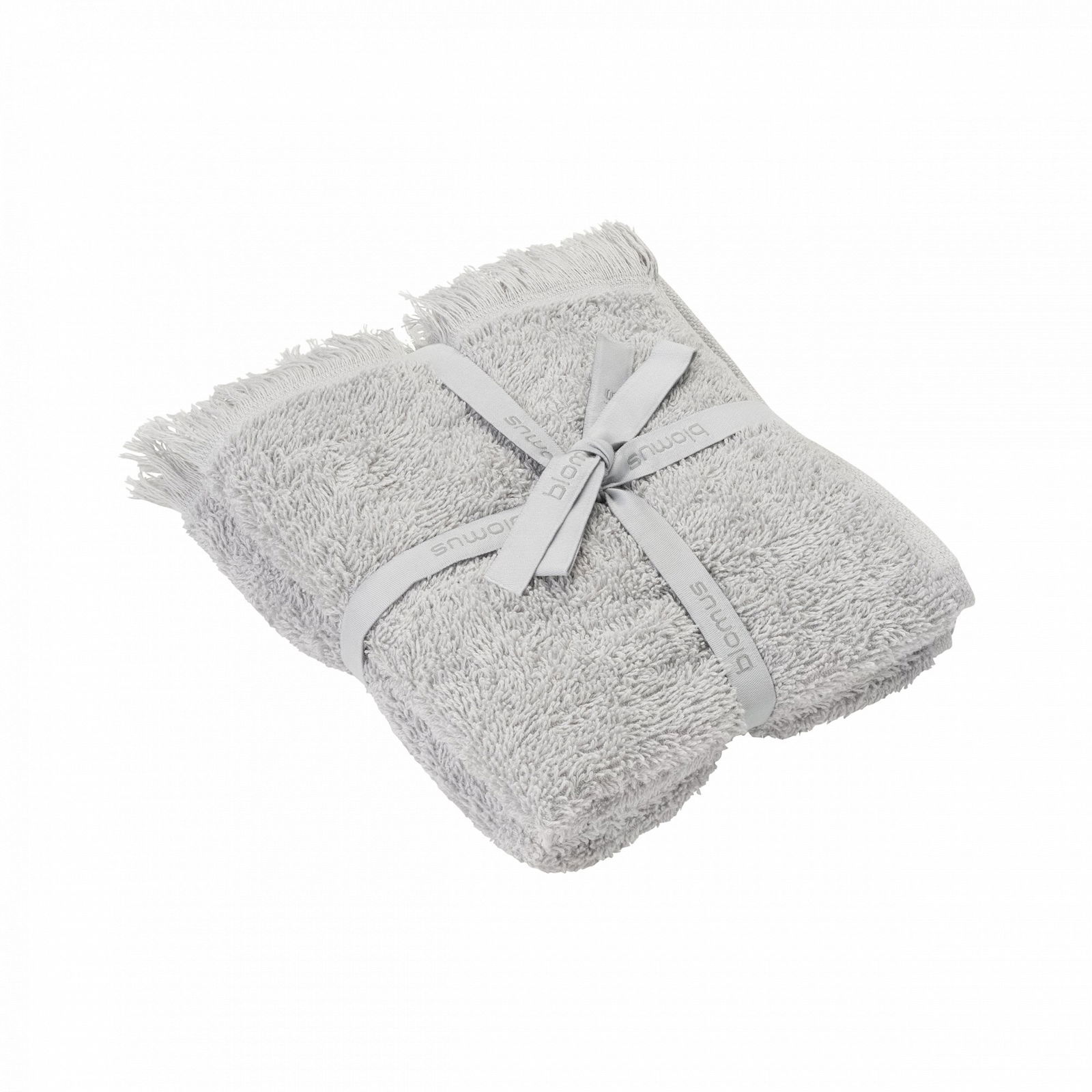 Soft grey towels neatly stacked and tied with a decorative ribbon on a black background.