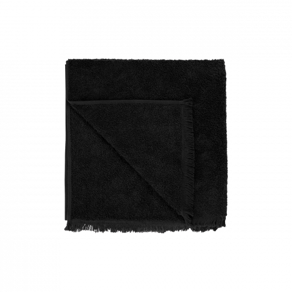 Soft black blanket with fringe edges, perfect for cozying up in style.
