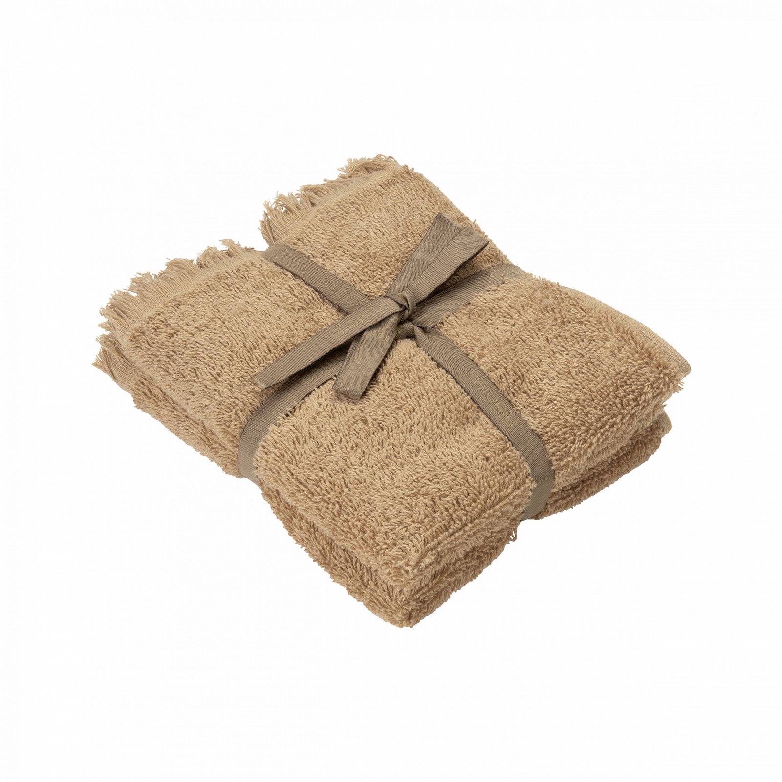 Soft, beige towel neatly tied with a ribbon on a black background.