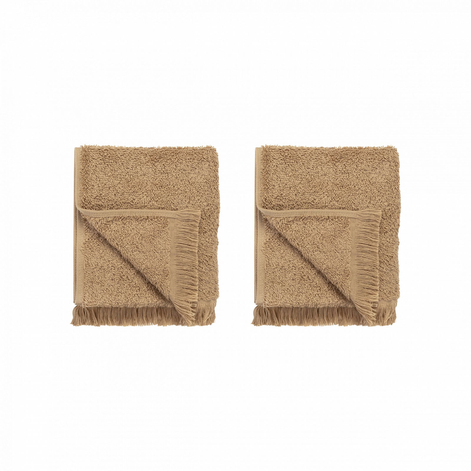 Two folded beige towels with fringed edges on a black background.
