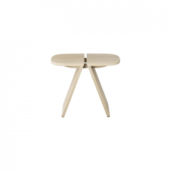 Modern minimalist round wooden table with angled legs on a black background.