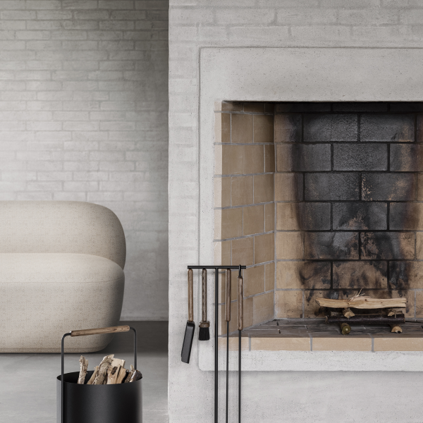 Cozy modern living room with a minimalist fireplace and stylish seating arrangement.