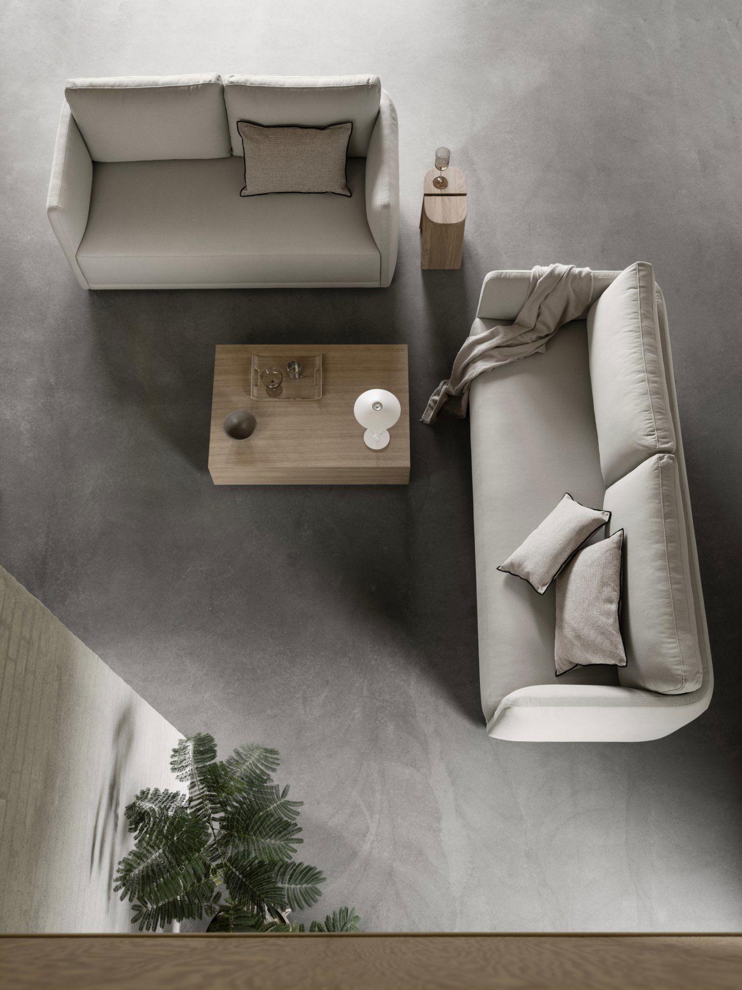 Moderner Wohnraum mit minimalistischen Sofas, einem Holzkaffee Tisch und stilvoller Dekoration.
