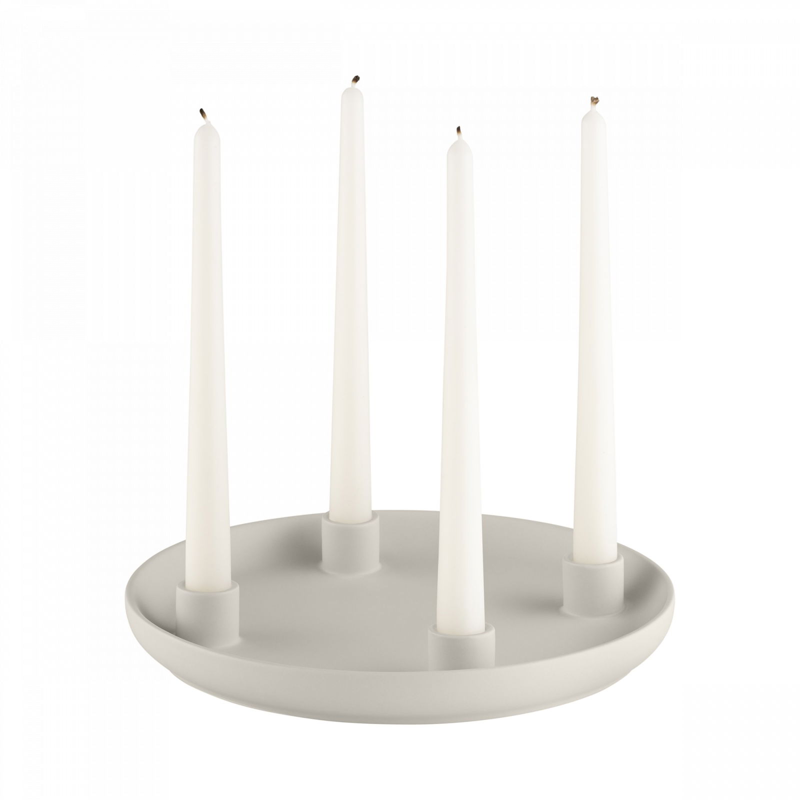 Elegant white candle holder with four tall candles in a minimalistic design.
