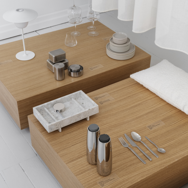 Modern minimalist dining setup with wooden tables and elegant tableware in soft lighting.