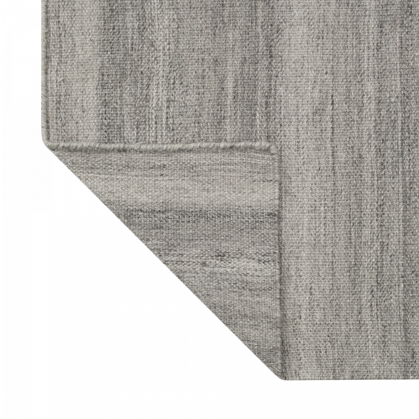 Gray textured rug corner showcasing a modern and elegant design for home decor.
