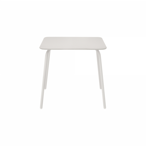 Modern white dining table with sleek legs for contemporary interiors.