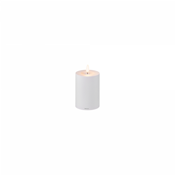 Elegant white candle with a soft flickering flame on a minimalist base.
