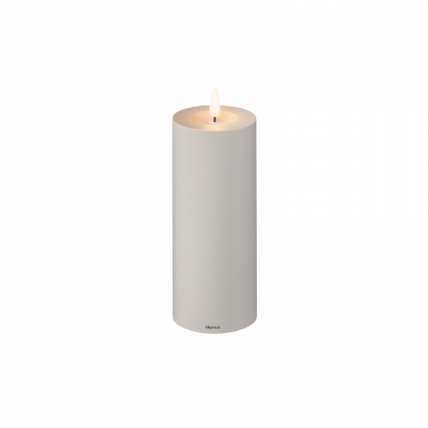 Battery-operated LED candle in white, providing a warm, flickering glow for home decor.