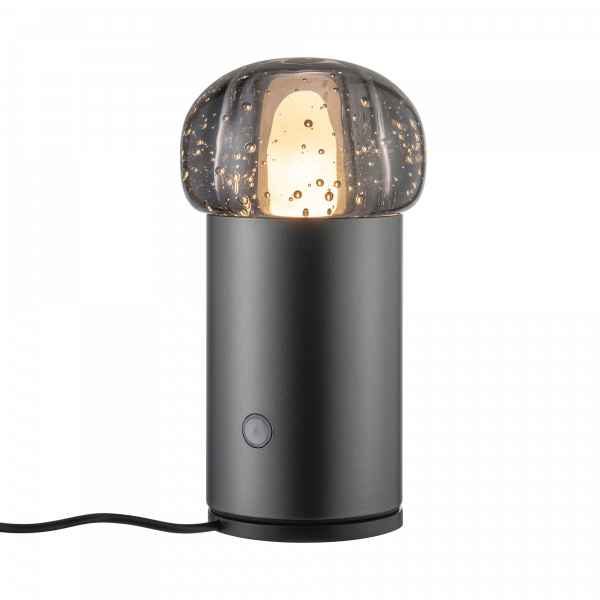 Moderne Tischlampe mit einem strukturierten Glasdom und einem eleganten schwarzen Fuß, die jeden Raum erhellt.