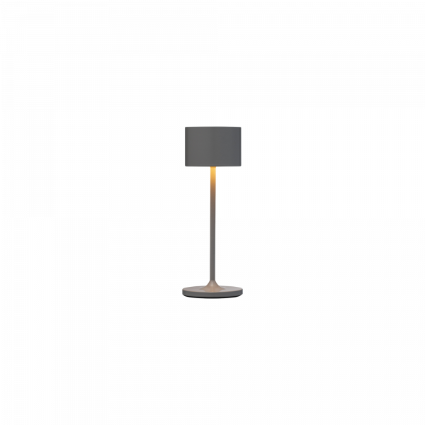 Moderne Tischlampe mit einem schlanken Design und sanftem, strahlendem Licht.