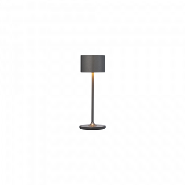 Moderne graue Tischlampe mit sleekem Design und warmem Licht für gemütliche Innenräume.