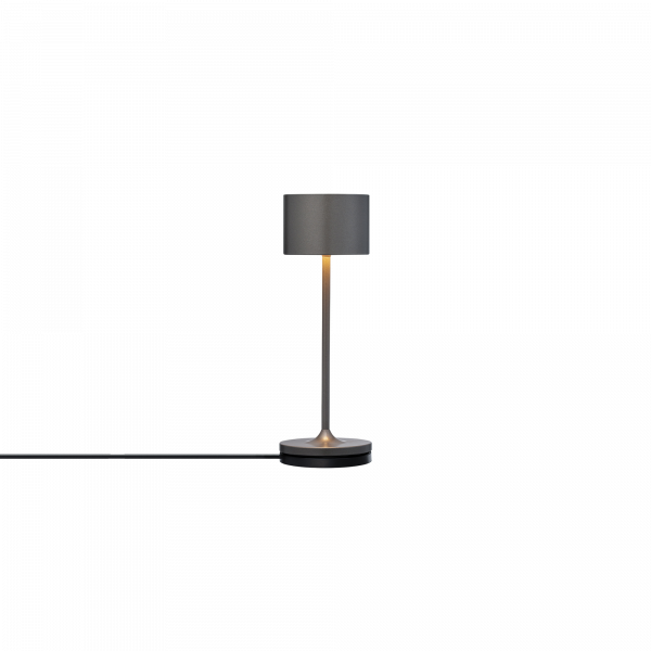 Moderne graue Tischlampe mit sleekem Design und warmem Licht, perfekt für jeden Raum.