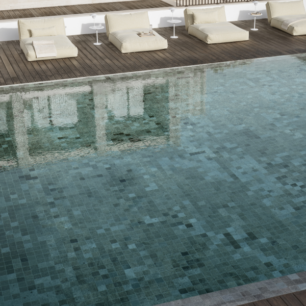 Luxurious poolside with loungers and clear water reflecting a serene atmosphere.