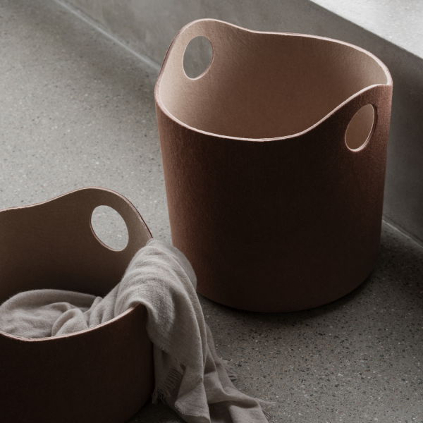 Stylish felt storage baskets with handles, perfect for organizing home spaces.