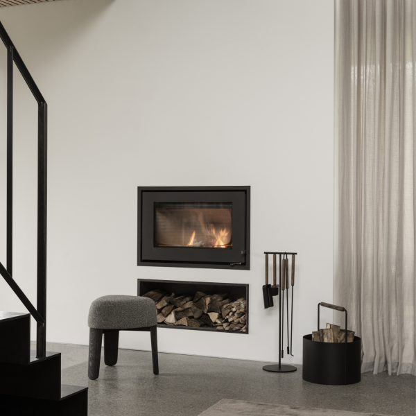 Modern living room with a sleek fireplace, wood storage, and stylish furniture.