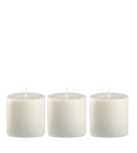Three small white candles arranged in a row against a plain background.