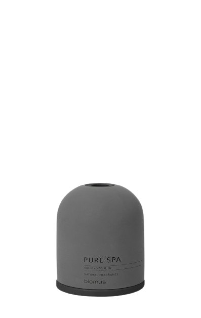 Stylischer grauer ätherischer Öldiffusor auf einem minimalistischen Hintergrund.