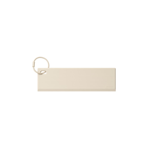 Minimalistic beige keychain with a ring for easy attachment.