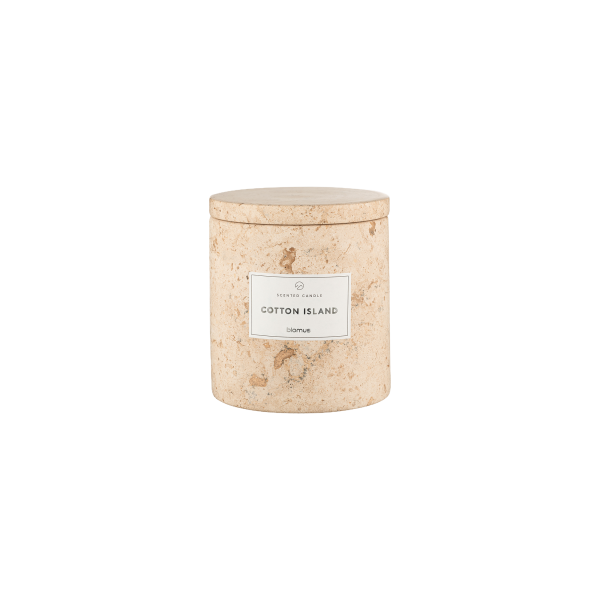 Natural scented candle in a textured cream jar labeled "Cotton Island."