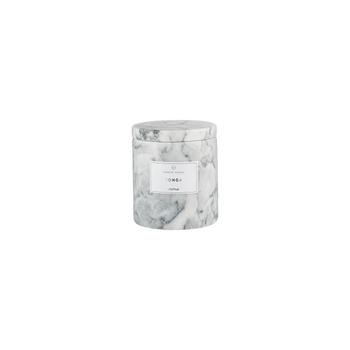 White marble candle container labeled "Tonga," stylish home decor piece for relaxation.
