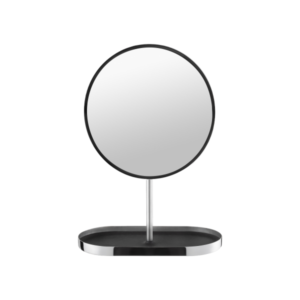 Modern round mirror with sleek chrome stand and black base for stylish home decor.
